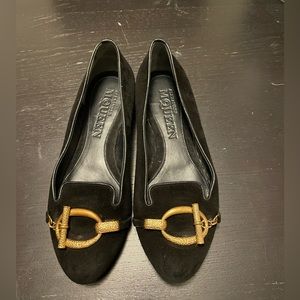 Alexander McQueen velvet flats with gold embellishments.